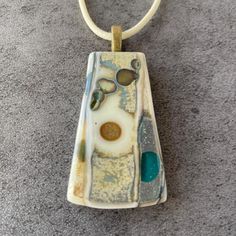 The item listed is a fused glass necklace that was handcrafted in my studio in Washington, NJ.This necklace was created by using a combination of glass fusing techniques. The ancient relic appearance was created by using the science of chemical reactions. All glass was heated in a kiln to a full fuse. After firing the piece was then cut using a ring saw and sanded on a grinder. Finally, it was put in the kiln again to be fire polished in order to give the piece a final shine.This necklace is approximately 1 inch X 1 3/4 inches and includes a 18 inch waxed cotton cord. It will ship in a lovely gift box with a satin ribbon. Fused Glass Necklace, Woodland Art, Chemical Reactions, Glass Fusing, Waxed Cotton, Glass Necklace, Cotton Cord, Cleaning Jewelry, The Science