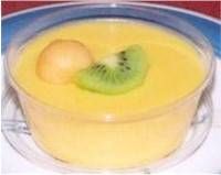 a close up of a bowl of food with a kiwi