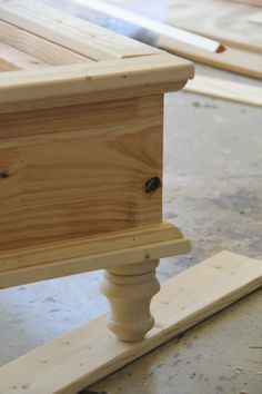 a close up of a piece of wood on top of a wooden flooring board