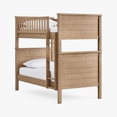 a wooden bunk bed with two white pillows