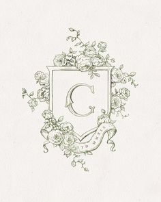 the letter c is surrounded by flowers and vines