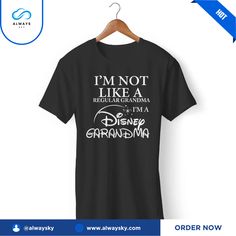 I'm Not Like A Regular Grandma I'm A Disney Grandma Disneyland Vacation Gildan Man's T-Shirt Alwaysky x Disney 2024. This well-made shirt is the epitome of comfort and elegance. Made from high-quality cotton, this adaptable piece may be worn in any setting. Raise the ante on your appearance with ease!. #grandma #Shirt #Alwaysky Black Pre-shrunk T-shirt For Disney Trips, Graphic Tee For Disney Trips In Black, Disney Letter Print Cotton T-shirt, Black Graphic Tee For Disney Trips, Cotton T-shirt With Letter Print For Disney Fans, Graphic Tee With Letter Print For Disney Fan Events, Black Cotton T-shirt For Disney Trips, Black T-shirt With Letter Print For Disney Trips, Disney Grandma