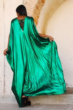 Introducing the Emerald Kaftan from our Regal Collection, an exquisite piece crafted from a glossy emerald green fabric. With its multiple arm holes and V neck, you can style this garment your way for an effortless, sophisticated look. Our model is 5'10, and is wearing our One Size Fits All. We offer world wide international shipping as well as local Trinidad & Tobago shipping and pick up options. 96% Rayon 4% Spandex Hand wash cold, air dry All orders are currently being shipped out of Trinidad Emerald Green Fabric, Trinidad Tobago, Cold Air, Black Style, Green Fabric, Silk Satin, Pretty Dresses, Air Dry, Emerald Green