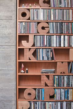 a bookshelf filled with lots of different types of cds