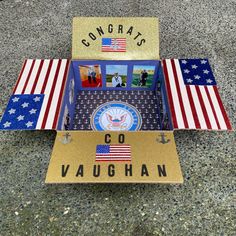 a cardboard box with an american flag and the words congrats go vaugh on it