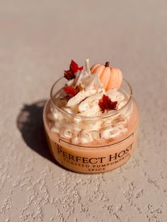 a small glass jar filled with food on top of a white tablecloth covered floor