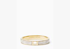 we say stack your bracelets to make a statement. this makes the first one in your pile. or the 100th. | Kate Spade Hole Punch Spade 10Mm Spade Hinge Bangle, Cream Multi Kate Spade Bangle Bracelets For Wedding, Kate Spade Bangle Bracelet For Weddings, Kate Spade Gold Bracelets, Silver Kate Spade Bangle Bracelet, Elegant Kate Spade Metal Bracelets, Kate Spade Elegant Bangle Jewelry, Kate Spade Gold Bangle, Adjustable Gold Kate Spade Bracelets, Bracelets To Make