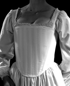 "Our c.1560 Anna style corset is cut to enhance the square-necklines of Tudor and early Elizabethan period dresses. It is rigidly boned across the front with 1/2\" steel bones which lift and compress the bust, creating the conical shape of this period. The front neckline has a modest upward curve, and the back is cut high. This style has ¾\" wide shoulder straps adjustable in the front. Available in our stock cotton coutil or in custom fabrics- (convo for details). First photo is custom silk wit Stays Pattern, 18th Century Stays, Ren Faire Costume, Period Dress, Corset Pattern, Historical Period, Overbust Corset, Layer Style, Historical Costume