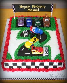 a birthday cake with cars on it