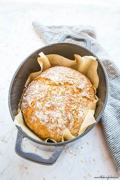 a loaf of bread sitting in a pan on top of a table