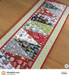 a table runner made out of many different fabrics