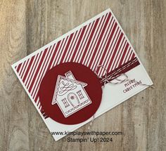 a close up of a card with a house on it and a tag attached to it