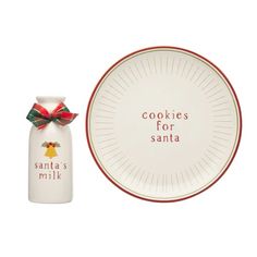 cookies for santa plate and salt shaker with red ribbon on white background, christmas ornament