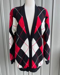 "Retro 80's/90's  Cardigan Sweater Black, Red, and Cream Argyle Pattern with Solid Back Label: Rena Rowan for Saville Made in Hong Kong 52% Acrylic 48% Lambswool Tagged dry clean but we washed on gentle/cold and laid flat to dry with good results Tagged: S (oversized fit) Actual Measurements: Pit to pit 21 inches Sleeves pit to cuff 20 inches  Length measured center back neck to hem 30 inches Shoulder to shoulder 20.5 inches Buttons up the front with 5 black buttons Nice vintage condition Soft a Red Velvet Blouse, Oversized Denim Shirt, Argyle Cardigan, White Cotton Blouse, Argyle Pattern, Ivory Sweater, Sweater Wool, Vintage Cardigan, Argyle Sweater