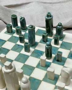 a close up of a chess board with pieces on it