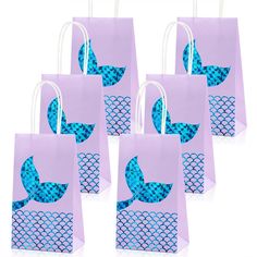 six purple bags with blue mermaid scales on them