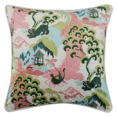 a pink and green pillow with an animal on it