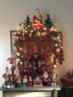 a christmas display with santas and other decorations