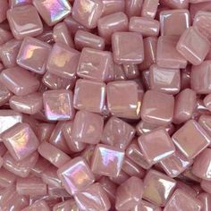 a close up view of pink glass tiles