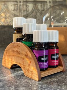 A mini personalized essential oil shelf with unique shapes and designs for small spaces or wherever you want to keep your favorite oils ready to go. Fits 6 oils (pictured for reference).  Personalize it with an engraved name or message and choose either the lavender, sunflowers or desert theme. Hand crafted from cherry hard wood. Finished with food safe 100% tung oil to bring out the natural wood grain while adding a layer of protection. Fits most small (5 ml) bottles. The circumference of the b Oil Shelf, Desert Theme, Essential Oil Shelf, Shelf Holder, Bottle Picture, Shelf Holders, Stand Display, Tung Oil, Unique Shapes