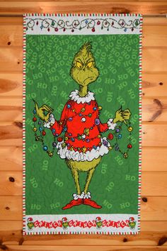 the grinch is dressed in red and green