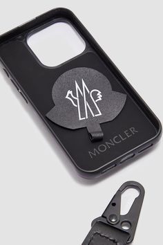 A striking design, the Nakoa phone case comes with a boudin-quilted effect, reminiscent of iconic Moncler down jackets. This phone case is crafted from lambskin and features an adjustable neck strap. The accessory is compatible with iPhone 15 Pro. Luxury Black Travel Phone Accessories, Luxury Black Mobile Phone Bag, Luxury Black Phone Accessories, Down Jackets, Black Phone Case, Leather Phone Case, Small Accessories, Accessories For Men, Neck Strap