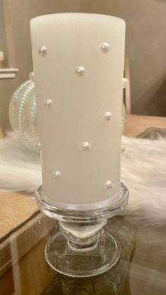 a large white cake sitting on top of a glass table