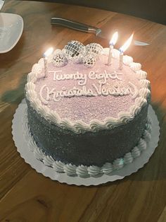 a birthday cake sitting on top of a wooden table