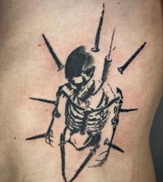 a man with a skeleton tattoo on his back holding a knife and fork in one hand