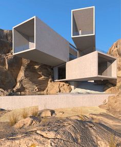 two concrete structures on top of a rocky mountain