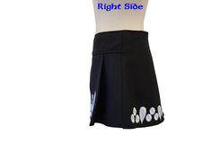 This fit-friendly Irish dance skirt is the perfect option for shows/competitions and will come in handy when your dancer is between dresses! The wrap-back style allows for an adjustable and comfortable fit. Crafted in the USA, this high-quality garment is made of black gabardine and features white embroidered crystal outlines and a Velcro closure around the back waist. Simply Prime skirts have two pleats in the front to allow for high kicks and quick movements. The skirts wrap around the back wi Fitted Asymmetrical Tennis Skirt For Summer, Fitted Asymmetrical Tennis Skirt For Spring, Fitted Flared Skort With Lined Skirt, Fitted Black Mini Wrap Skirt, Black Fitted Mini Wrap Skirt, Fitted Skirt For Spring Dancewear, Fitted Short Skirt With Lining, Fitted Pleated Tennis Skirt For Cheerleading, Fitted Skirt For Dance In Spring