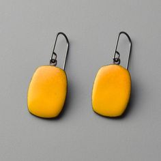 Enamel & Steel Earrings - These modern steel drop earrings feature a bold field of canary-yellow enamel. Their rich, colorful surface is created by sifting, layering, and melting powdered glass onto steel. They feature oxidized sterling silver ear wires and ship with custom, handmade backings. Yellow Enamel Earrings, Modern Yellow Earrings For Everyday Wear, Modern Yellow Earrings For Everyday, Modern Yellow Teardrop Jewelry, Yellow Teardrop Earrings For Everyday, Yellow Teardrop Everyday Earrings, Modern Yellow Nickel-free Jewelry, Emma Necklace, Artful Home