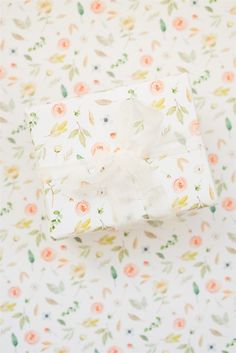 a white wrapping paper with flowers on it