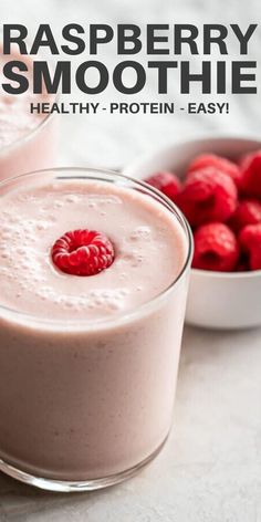 raspberry smoothie in two glasses with fresh raspberries on the side