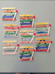 popsicle art made with colored toothpicks and clothes pins