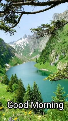 the words good morning are written in front of a mountain lake and trees with mountains in the background