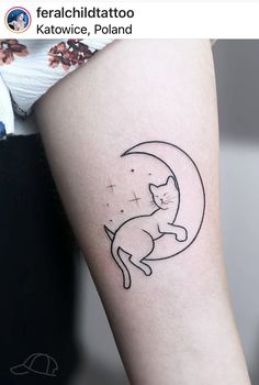 a cat is sitting on the moon tattoo