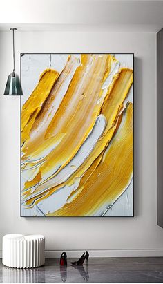 an abstract painting hangs on the wall next to a radiator and two lamps