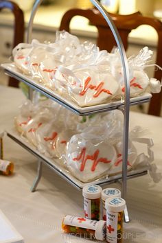 the trays are filled with candy and wrapped in cellophane for guests to take home