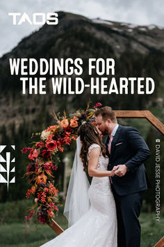 a bride and groom kissing in front of a photo frame with the words, wedding for the wild - hearted