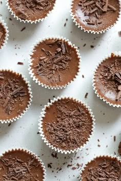 chocolate cupcakes sitting on top of a white tray