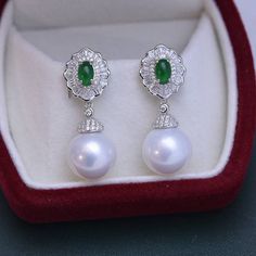 11-12mm Pearl CZ Green Gems RingElevate your style with our 11-12mm Pearl CZ Green Gems Earrings, a dazzling blend of elegance and sophistication. The lustrous pearl, complemented by vibrant green CZ gems, creates a stunning focal point. Crafted with precision, this exquisite ring promises to be a radiant addition to your jewelry collection, perfect for any occasion. Material: Freshwater Pearl with 925 sterling silver, cubic zirconia Product Information Pearl Type Freshwater Pearl Origin China S Luxury Green Pearl Earrings For Festive Occasions, Elegant Green Pearl Earrings For May Birthstone, Elegant Green Pearl Drop Earrings, Green Pearl Earrings For Wedding (may Birthstone), Luxury Green Pearl Drop Earrings, Gem Earrings, Product Introduction, Green Gems, Pearl Types