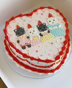 there is a cake decorated with cats on it