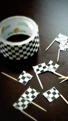 several pieces of tape and toothpicks on a table