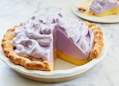 there is a pie on the table with one slice cut out and ready to be eaten