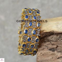 Blue Sapphire Bracelet, Pave Diamond Bracelet, Diamond Link Bracelet Jewelry, 925 Silver Bracelet, Gold Vermeil Jewelry, Anniversary Gift Gross Weight: 56.76 gram Gemstone Weight: 24.14 cts Diamond Weight: 3.70 cts Bracelet Width: 21 MM Bracelet Size: 7 inch NOTE:- All The Products Are Designed And Manufactured In My Workshop By Me & My Team. Shown Products Are Purely Handmade. Custom Orders Are Open Handly Accepted. We Are Perfect Choice For Any Custom Jewelry Manufacturing. For Bulk Orders Blue Fine Jewelry Bangle For Gifts, Hand Set Blue Diamond Bracelet As Gift, Blue Hand Set Diamond Bracelet As Gift, Blue Sterling Silver Bangle Bracelet, Sapphire Bangle Jewelry For Anniversary, Traditional Blue Sterling Silver Bracelets, Blue Hand Set Fine Jewelry Bracelet, Sapphire Color Cubic Zirconia Diamond Bracelet Gift, Traditional Blue Gemstone Bracelets