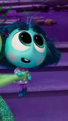 an animated character with blue hair and big eyes, holding a green object in her hand