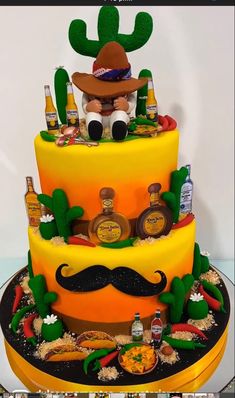 a three tiered cake decorated with an image of a man's moustache