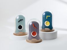 three clocks with different shapes and sizes on them