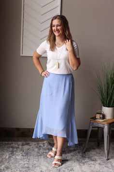 Elevate your spring/summer wardrobe with our Spring Blue Ivory Polka Dot Hi-Low Skirt. Perfect for church, weddings, and more, this pretty skirt gives off a light and airy vibe. Enjoy the warm weather in style with this must-have, stylish skirt. Hi-Low Hem • Elastic back waistband with a flat front Material: Dressy, non-stretch • Typical size Medium (8) bottom wearing the Small. The Fit of This Boutique Skirt: Typical 5'4"/Medium (8) bottom, wearing the Small. Flat Across Measurements in Inches Size: Waist Across Hips Across Length X-Small Small 13.25 19 30 front/36 back Medium 14 20 30 front/37 back Large 15.25 21 30 front/37 back X-Large 15.75 23 31 front/38 back Polka Dot Tiered Skirt For Spring, Elegant Polka Dot Skirt For Spring, Modest Tiered Maxi Skirt For Summer, Polka Dot Long Skirt For Spring, Modest Tiered Skirt For Spring, Modest Tiered Skirt For Summer, Flowy Lined Skirt For Brunch, Breezy Gathered Skirt For Spring, Breezy Relaxed Lined Skirt